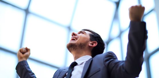 A man in a suit and tie looking up.