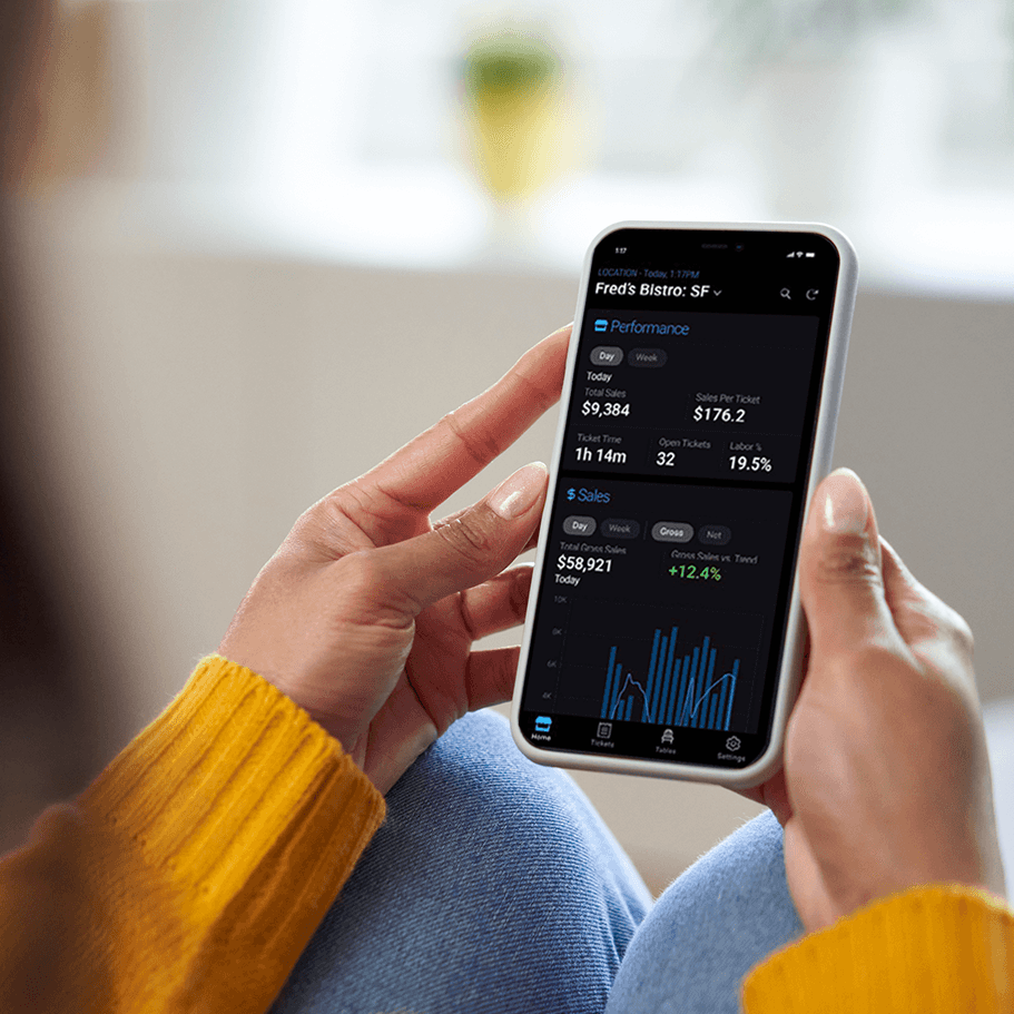 Person checking stock app on smartphone.
